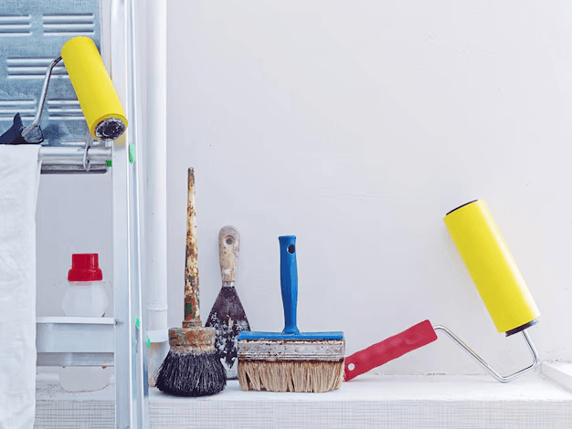 Professional painter working on interior walls