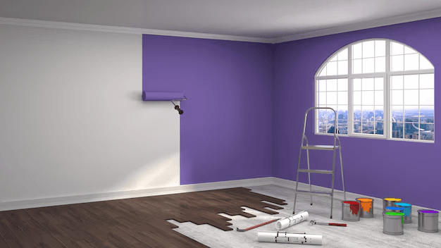 Professional painter working on interior walls