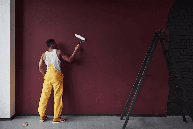 Professional basement wall painting with burgundy color finish